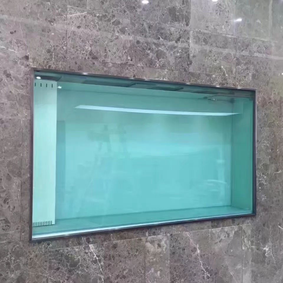 Custom-made home fish tanks with three-story grey marble walls and built-in empty tanks