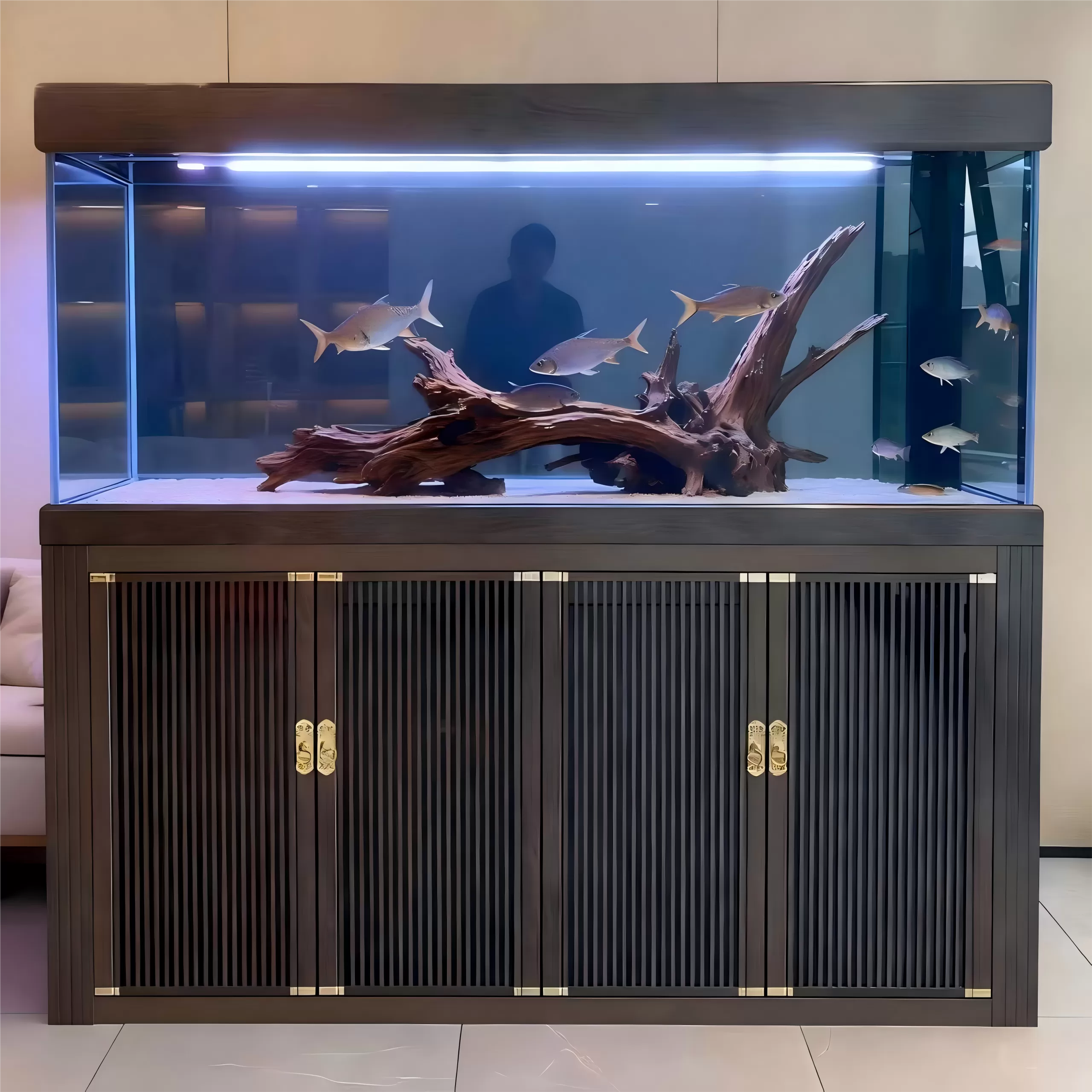 Custom-made original landscape fish tanks with deep wood louvers, copper handles and driftwood
