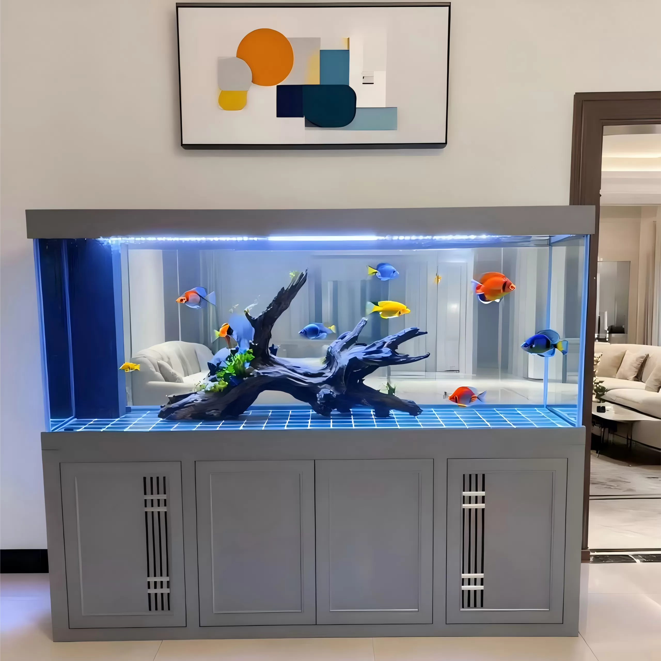 Custom-made large ornamental fish tanks with grey fume hood doors and driftwood landscaping